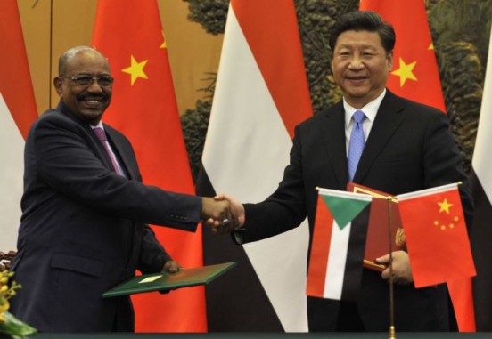 ICC fugitive Omar al-Bashir with Chinese President Xi Jinping. Beijing, 1 Sept 2015. © AFP